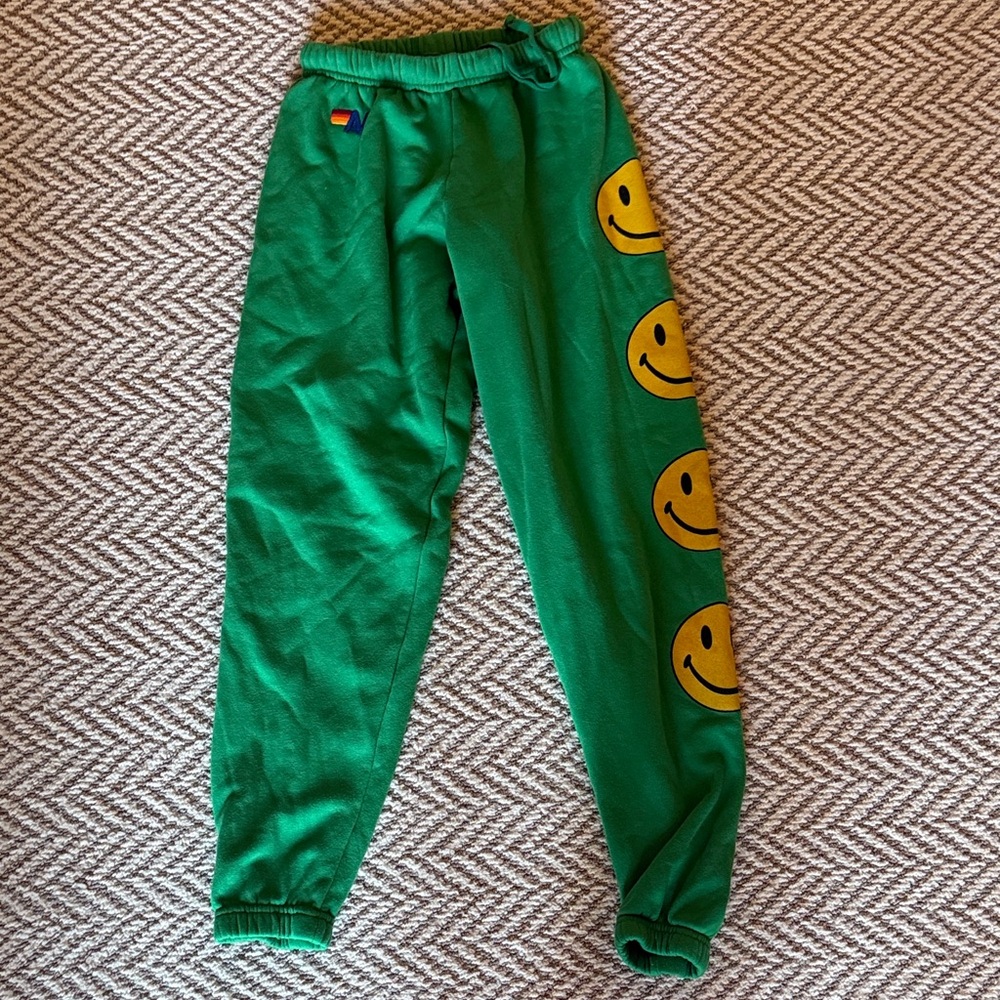 Aviator Nation Green Joggers with Yellow Smiley Design